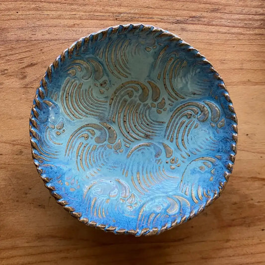 This small seafoam and blue handmade pottery dish features a natural wave texture.