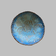 This small seafoam and blue handmade pottery dish features a natural wave texture.