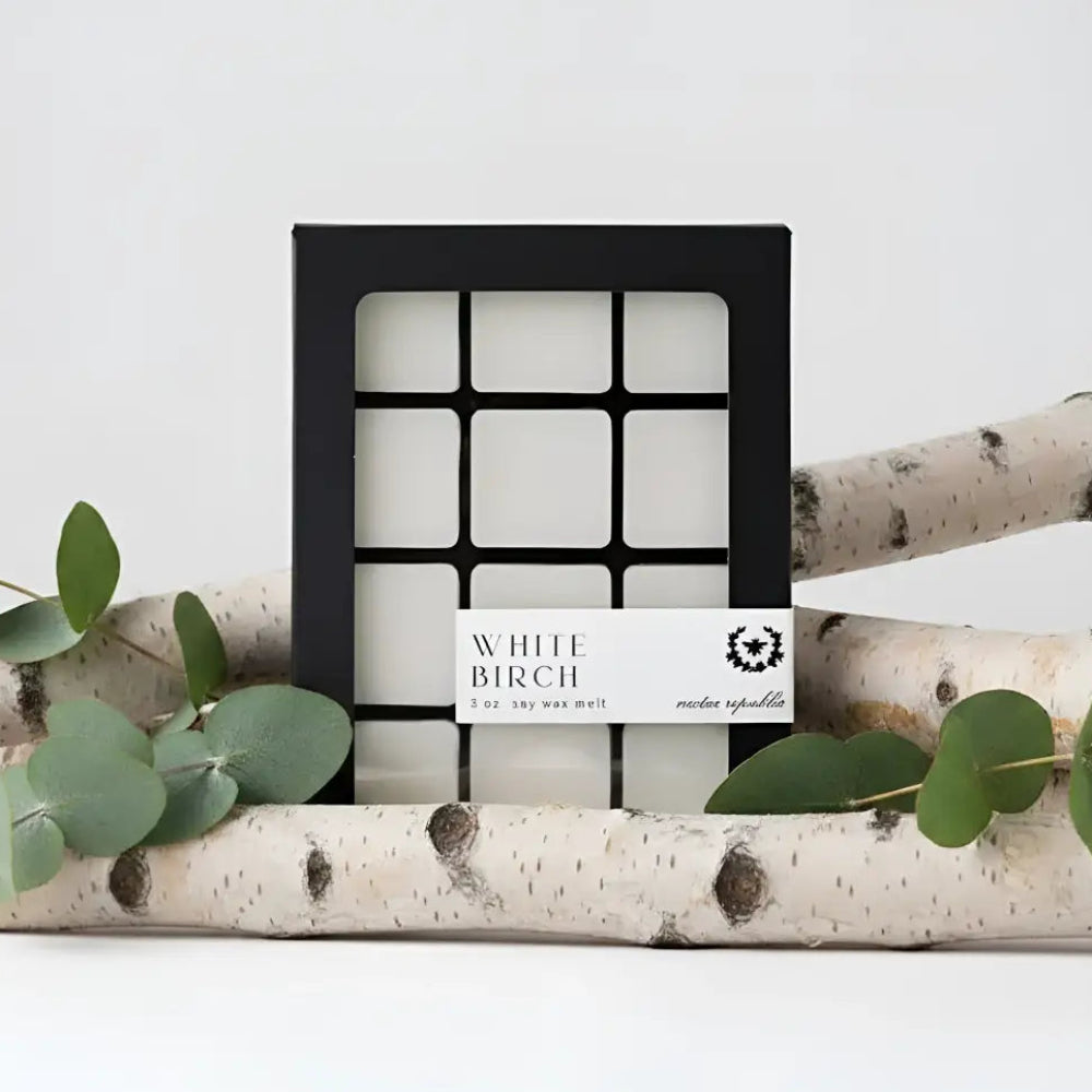 Black-framed box with white birch wax melts by moxie republic featuring bright citrus and birch wood scents