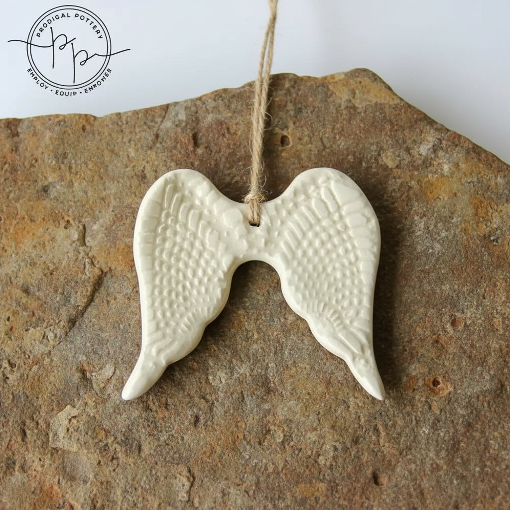White ceramic angel wing ornament perfect for year-round gifting and home decor