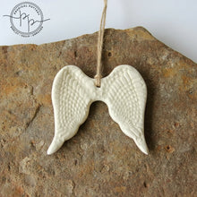 White ceramic angel wing ornament perfect for year-round gifting and home decor