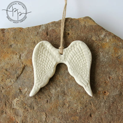 White ceramic angel wing ornament perfect for year-round gifting and home decor