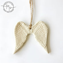 White ceramic angel wing ornament with twine hanger for year-round gifting