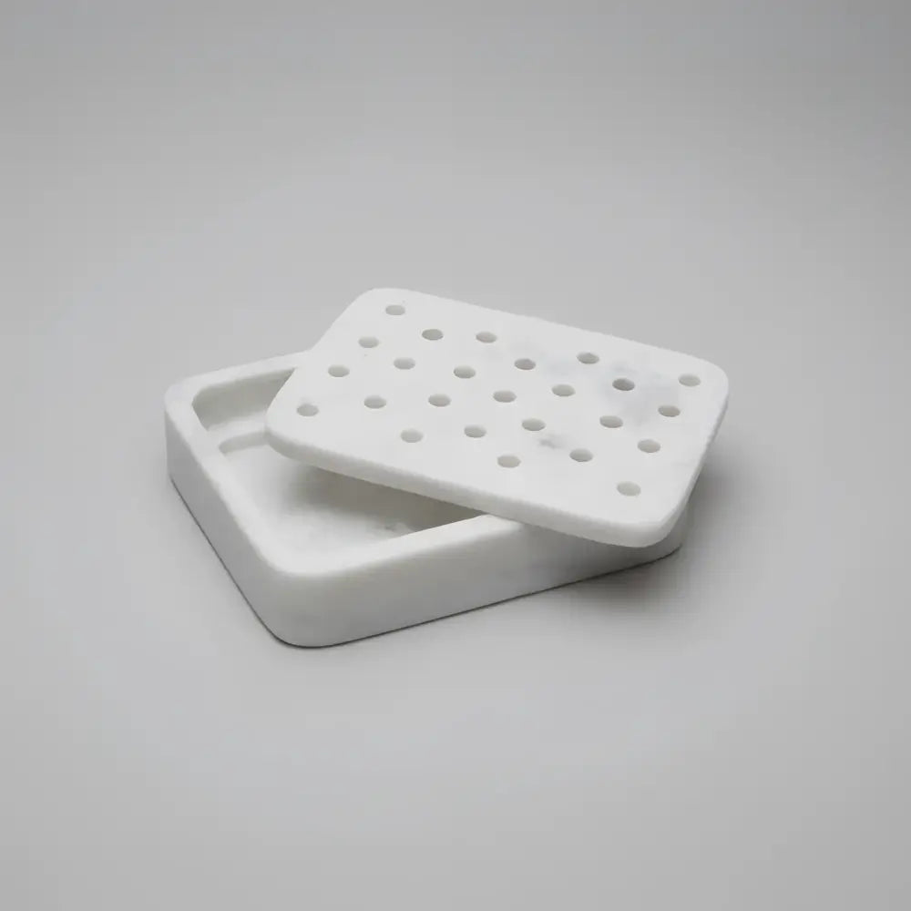Charming white marble soap dish with hinged lid and perforations