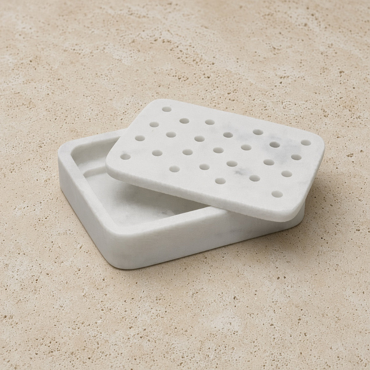 White marble soap dish with a perforated lid perfect for a charming soap dish pedestal moment in your bathroom