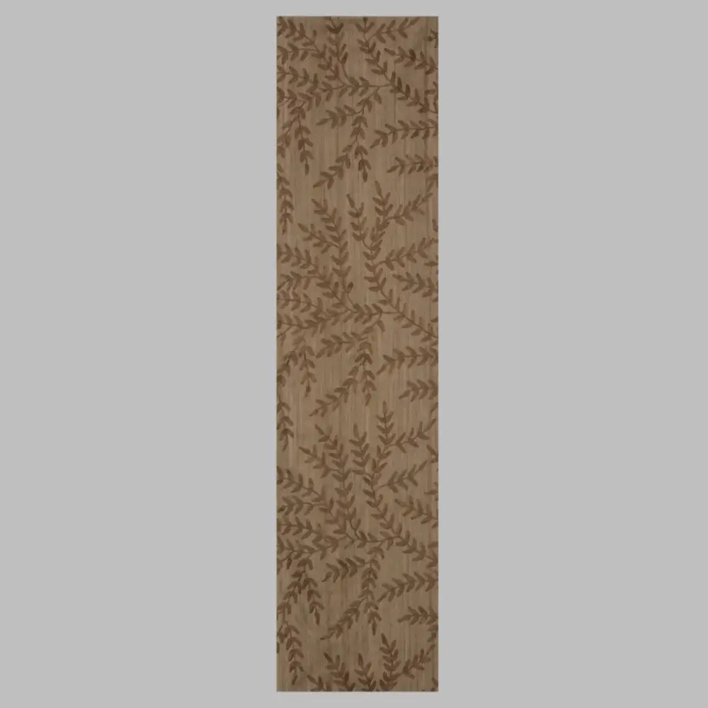 Beige table runner with chocolate brown woven leaf design.