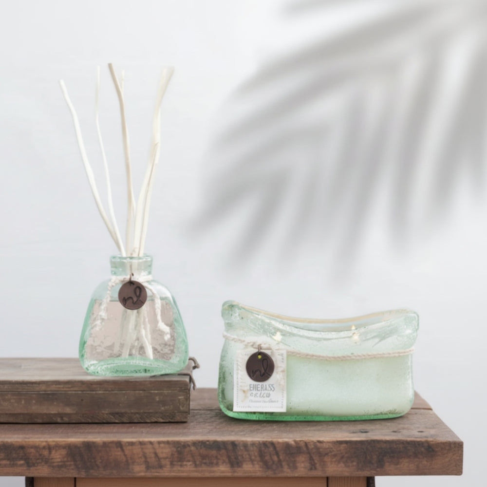 Handmade seafoam green glass candle with sea rose sea salt scent