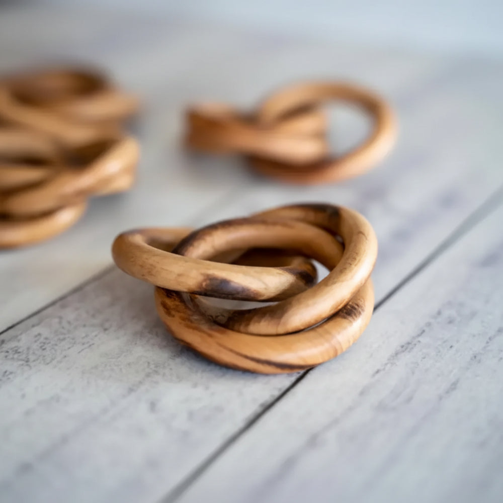 Handcrafted wooden napkin rings with warm brown wood grain finish