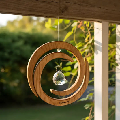 Wooden spiral with crystal spinner ornament featuring a handcrafted wood spiral and clear teardrop crystal center