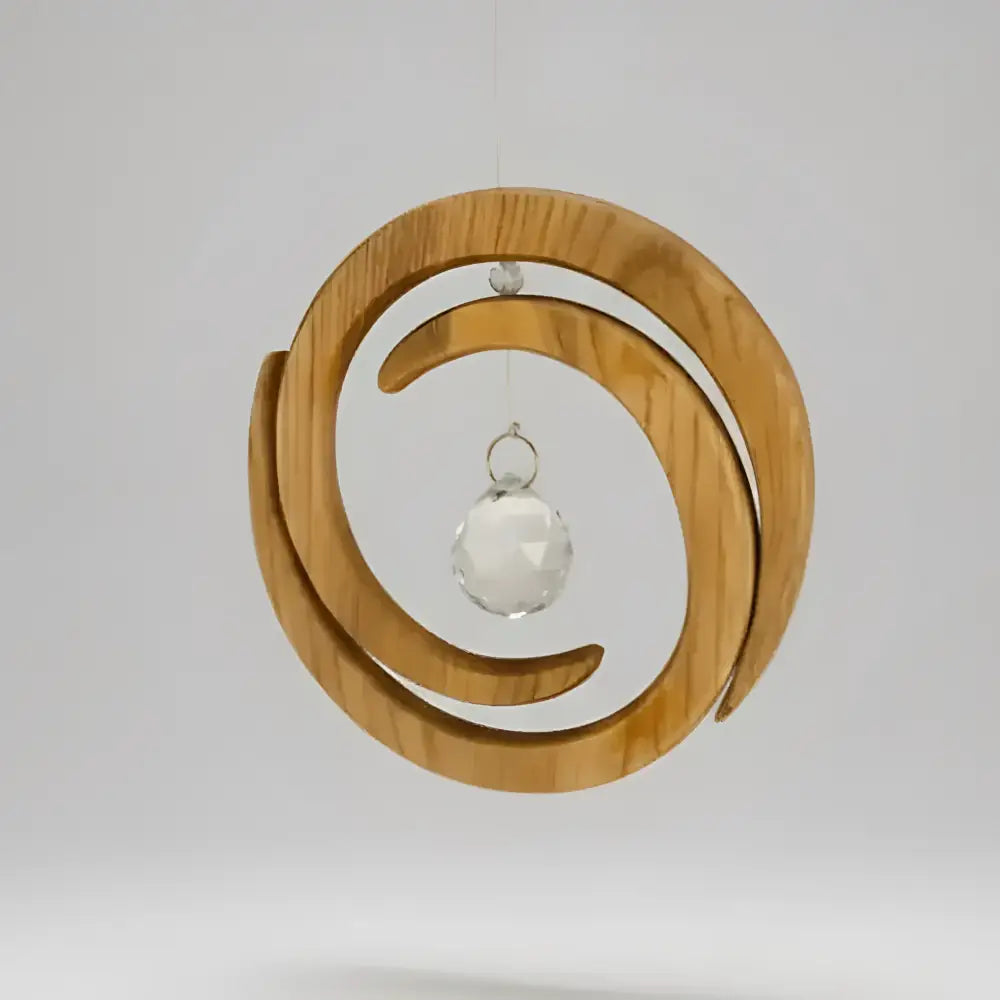 Delicate handcrafted wood spiral ornament with a clear faceted crystal pendant perfect for hanging decor