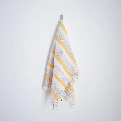 Ivory and yellow Turkish cotton hand towel with tassels and striped yellow and white design