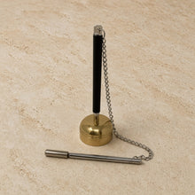 Black and gold brass zen bell with chain and striker featuring resonant tone perfect for mindfulness practices